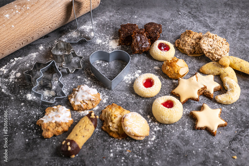 Christmas treats, freshly baked Christmas biscuits with baking utensils