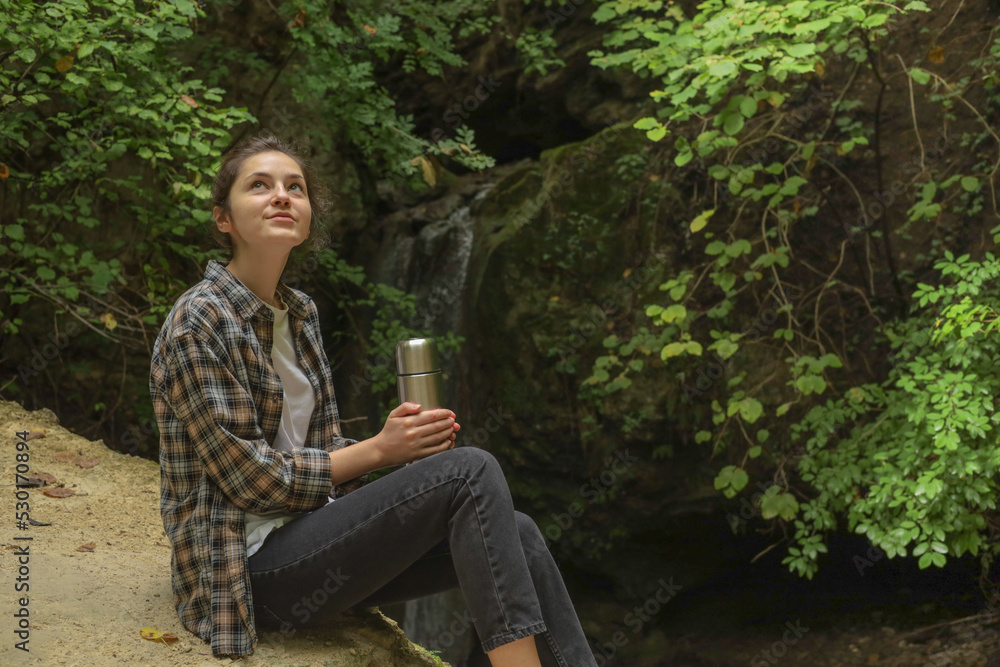 girl in the forest with a thermos girl in the forest with a thermos