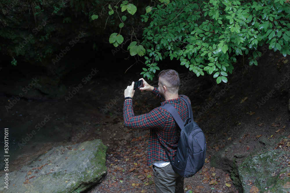 a man in the forest with a phone a man in the forest with a phone