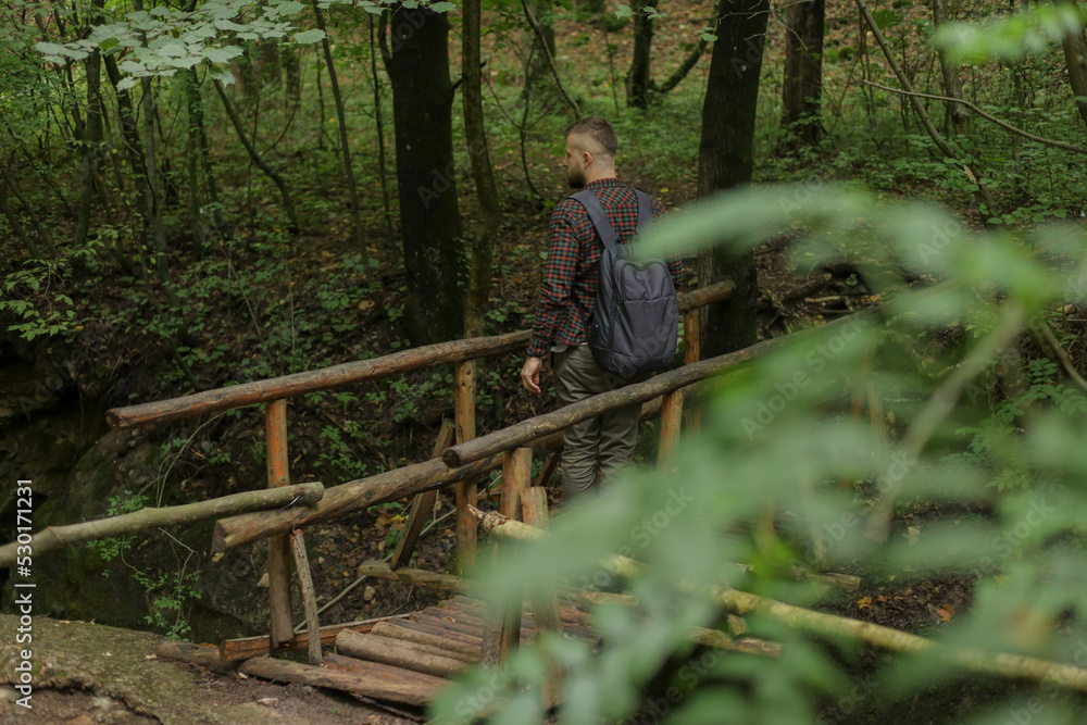 a man in the forest with a phone a man in the forest with a phone