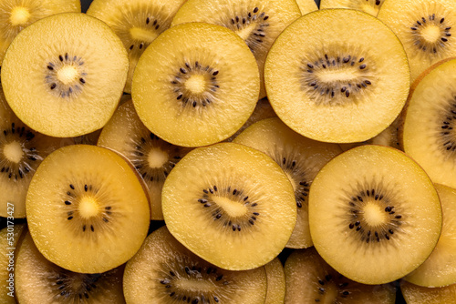 Macro background photography of slised golden kiwi