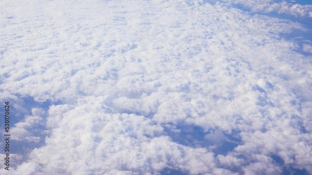 Fluffy clouds that looks as flat surface as seen from commercial airplane Fluffy clouds that looks as flat surface as seen from commercial airplane