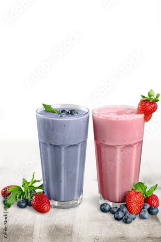 Glasses of berry smoothie or milkshake. Healthy breakfast drink