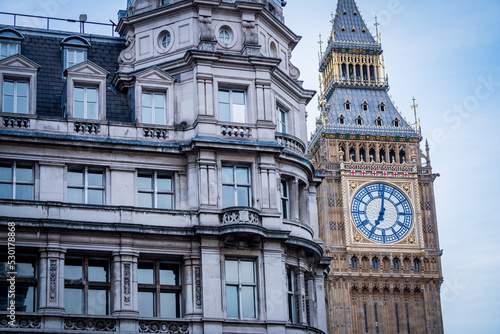 The Elizabeth Tower (Big Ben) at the Palace of Westminster (Houses of Parliament) blocked by a Whitehall Building, the seat of British Democracy photo