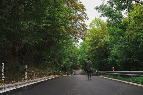 Wallpaper Mural beautiful girl walks in the forest near the road Torontodigital.ca