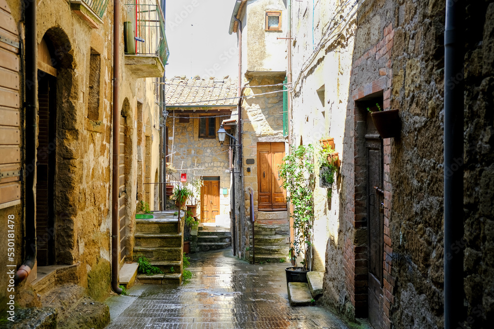 Narrow street on a spring day in small town Pitigliano, Tuscany