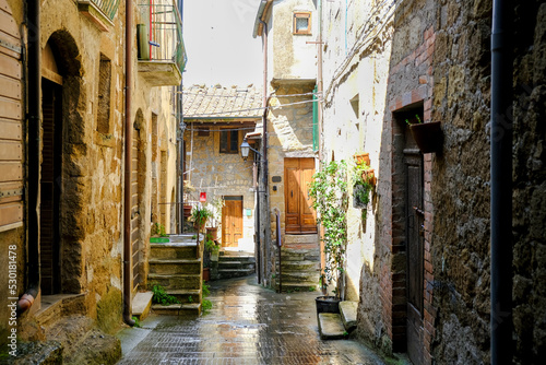 Narrow street on a spring day in small town Pitigliano, Tuscany