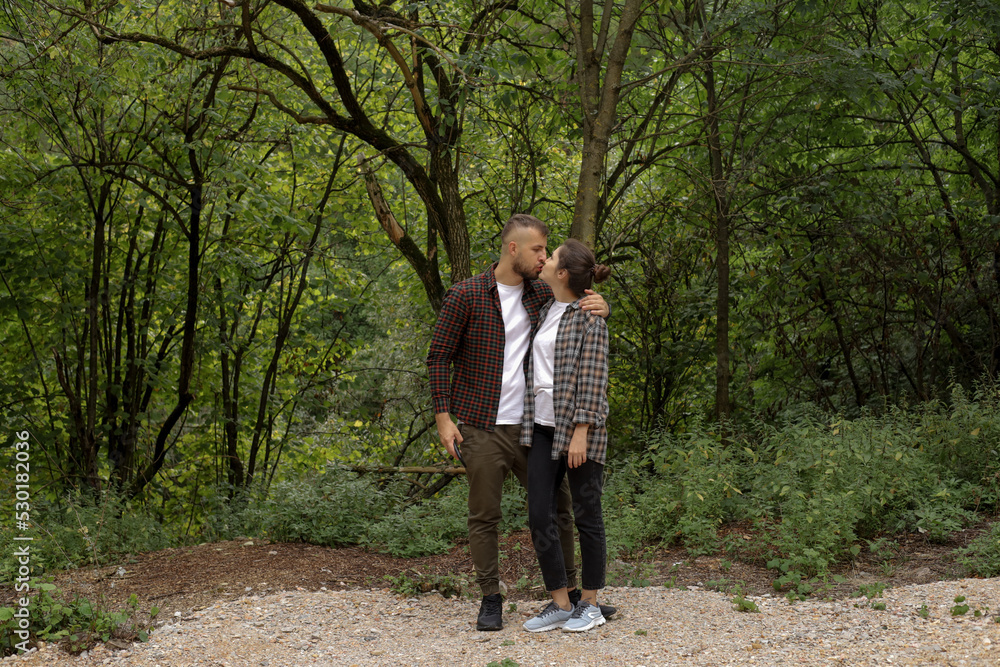 Fototapeta premium a couple in love outdoors in the forest