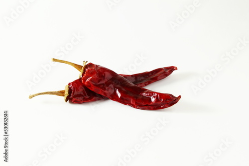 dry organic kashmiri red chili pepper well known for dark red color food recepi in indian gujarati food isolated on white background,selective focus
 photo