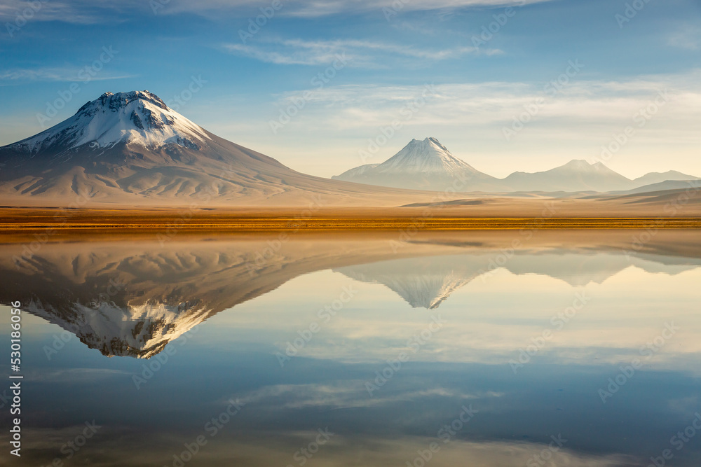 Idyllic Lake Lejia reflection and volcanic landscape in Atacama desert, Chile