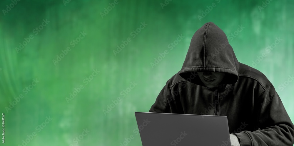 Brutal man looking is from under a black hood. Security concept. Brutal man looking is from under a black hood. Security concept.