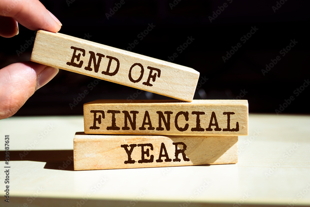 Wooden blocks with words 'End Of Financial Year'. Business concept Wooden blocks with words 'End Of Financial Year'. Business concept