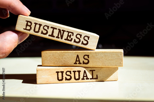Tablou pe pânză Wooden blocks with words 'Business as Usual'. Business concept
