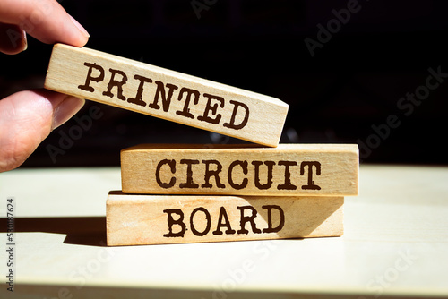 Wooden blocks with words 'Printed Circuit Board'.