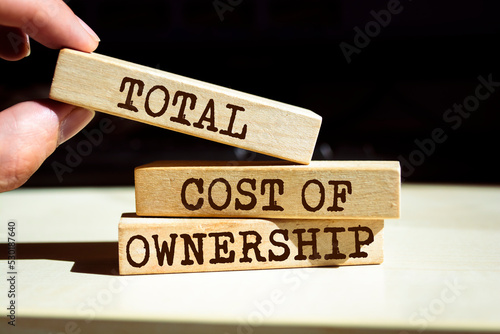 Wooden blocks with words 'Total Cost of Ownership'. Business concept