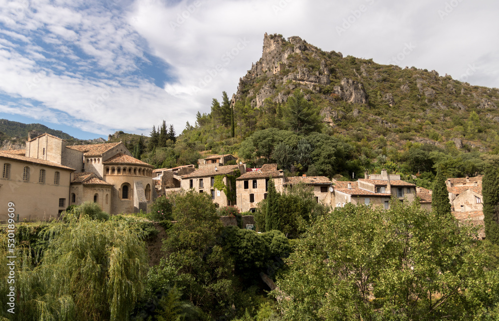view of Saint-Guilhem-le-Désert medieval town in southern France