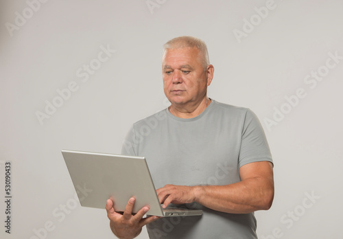 senior man working on laptop