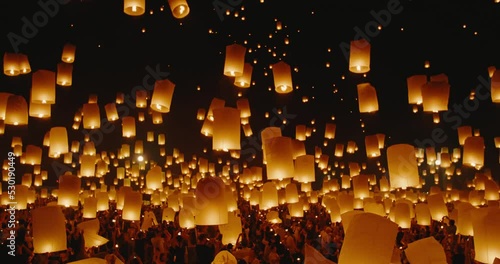 Amazing sky lanterns lifting up into the night sky, world travel and adventure, Fire Lanterns at the Yee Peng Festival in Chiang Mai Thailand, Shot on RED Cinema