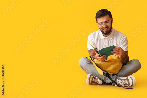 Handsome tattooed student w...