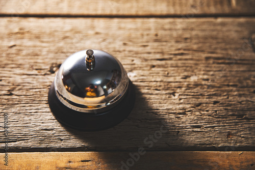 office bell on wooden table