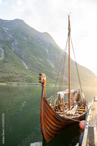 Viking boat in front of the mountain photo