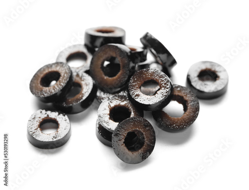 Heap of cut black olives isolated on white background