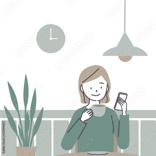 カフェでスマートフォンを見る女性