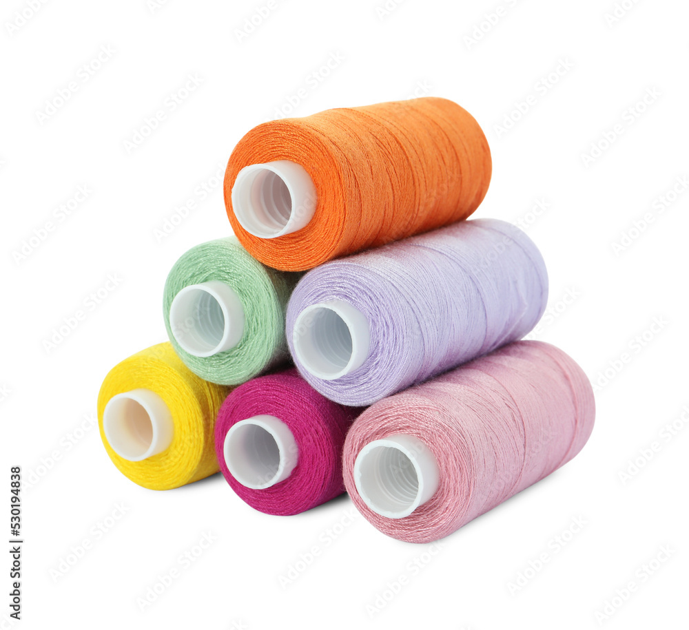 Different colorful sewing threads on white background Different colorful sewing threads on white background