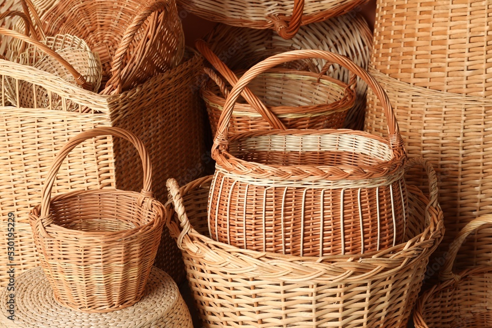 Many different wicker baskets made of natural material as background Many different wicker baskets made of natural material as background