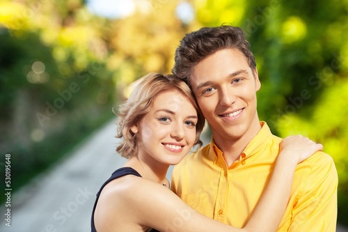 Happy young loving couple posing. Couple embracing