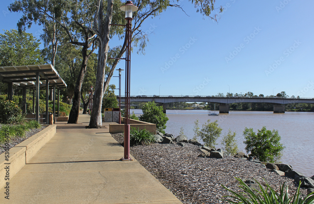 View of the Rockhampton waterfront with a path, Fitzroy River and bridge in Queensland, Australia View of the Rockhampton waterfront with a path, Fitzroy River and bridge in Queensland, Australia