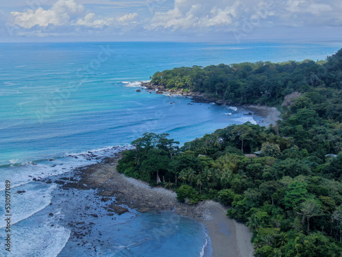 Aerial of Matapalo beach in Costa Rica Osa Peninsula showing how the wild pacific meets the protected rainforest photo