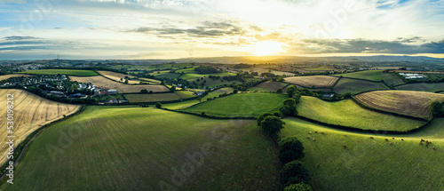 Sunset over Farmlands and Fields from a drone, Devon, England, Europe photo