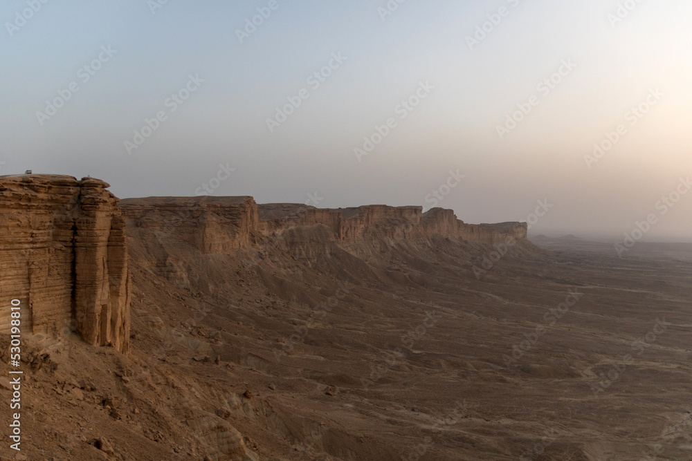 the edge of the world near riyadh, saudi arabia at sunset