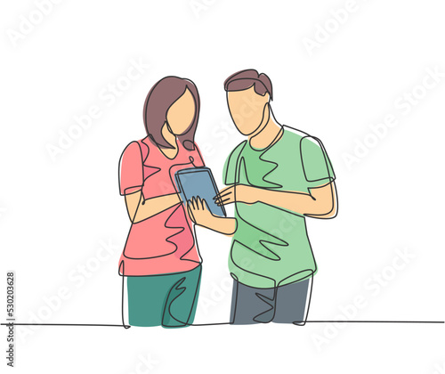 One continuous line drawing of young male and female employee talking about company target while staring tablet screen. Business goal discussion concept single line draw design vector illustration