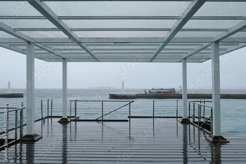 A rainy day at Malé presidential speedboat jetty, Maldives. North Male Atoll, Male Island