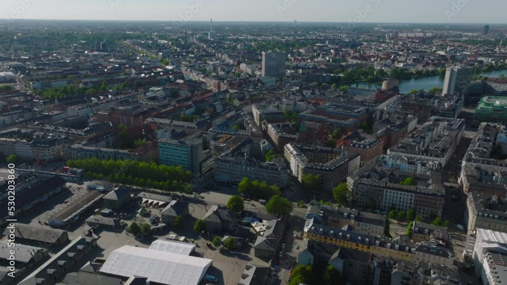 Aerial view of townhouses in urban borough in metropolis. Tilt up reveal of flat landscape. Copenhagen, Denmark Aerial view of townhouses in urban borough in metropolis. Tilt up reveal of flat landscape. Copenhagen, Denmark