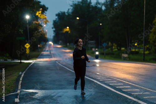 Asian ladies running in the rain