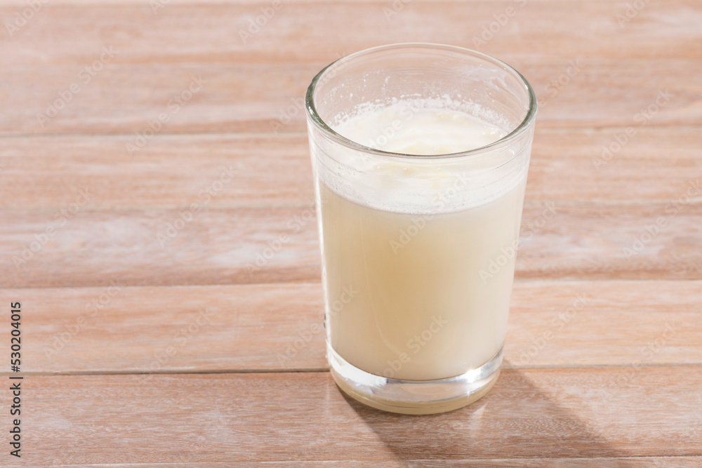 Glass of dehydrated milk powder with nutrients Glass of dehydrated milk powder with nutrients