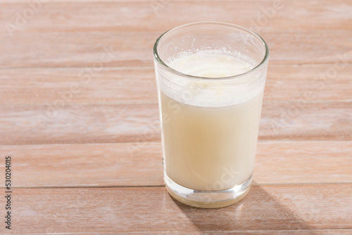 Glass of dehydrated milk powder with nutrients