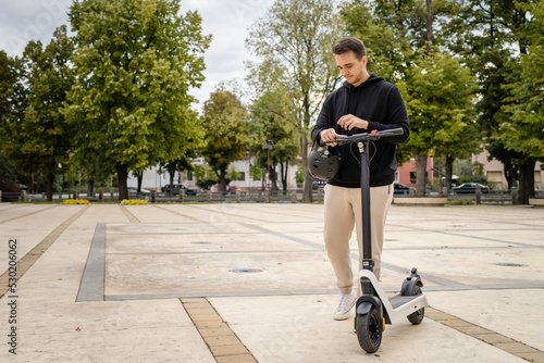 caucasian man drive or ride electric kick scooter e-scooter