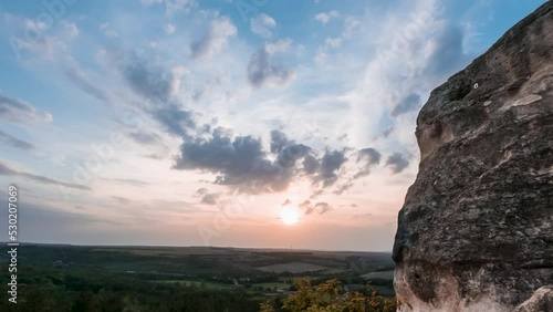 Beautiful, Gorgeous Twilight Sunset Time Lapse At The Foot Of A Huge Rock, Lovely Colors, Clouds photo