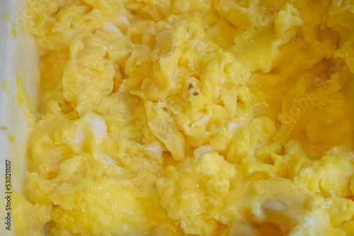 Solf scrambled egg, a close up of American traditional homemade fried scramble eggs breakfast food background.