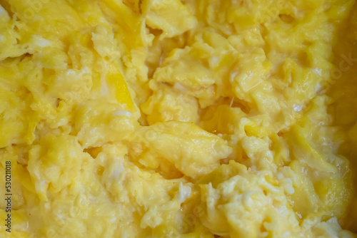 Solf scrambled egg, a close up of American traditional homemade fried scramble eggs breakfast food background.