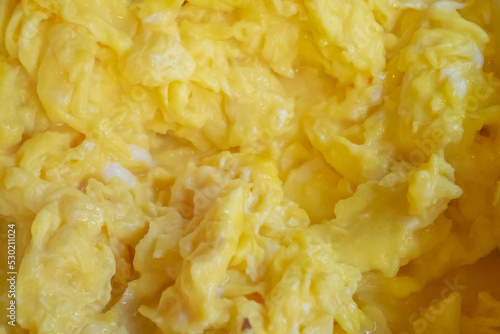 Solf scrambled egg, a close up of American traditional homemade fried scramble eggs breakfast food background.