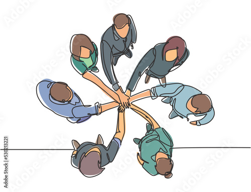 One single line drawing group of young happy business people unite their hands together to form a circle shape symbol, top view. Trendy teamwork concept continuous line draw design vector illustration
