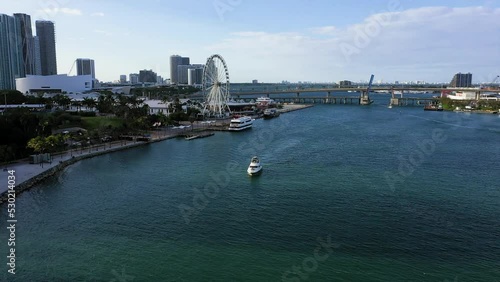 Aerial view towards a yacht driving in front of Bayfront Park in Miami, USA photo