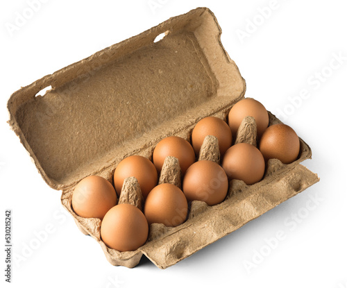 fresh brown chicken eggs in an egg box which made of recycled materials, isolated on white background, healthy organic food concept