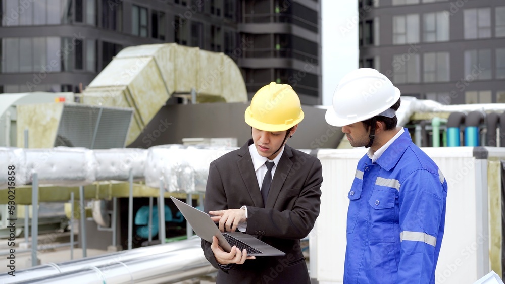 Professional Asian foreman and construction manager talking - discussing together. Professional Asian foreman and construction manager talking - discussing together.