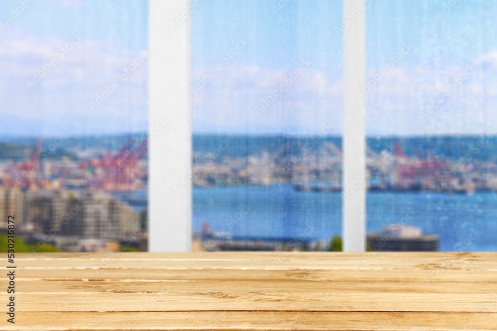Wood table with window glass and city background. Wood table with window glass and city background.